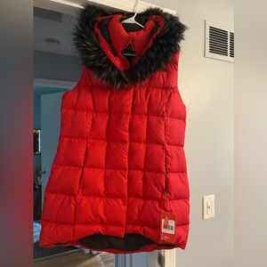 Goose filled, 24”pit to pit. 33” shoulder to bottom. 4” longer on back